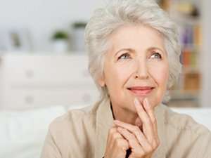Image of an elderly woman thinking.