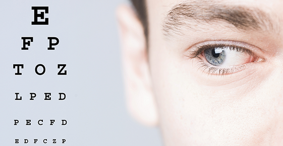 Image of man looking at eye chart. 